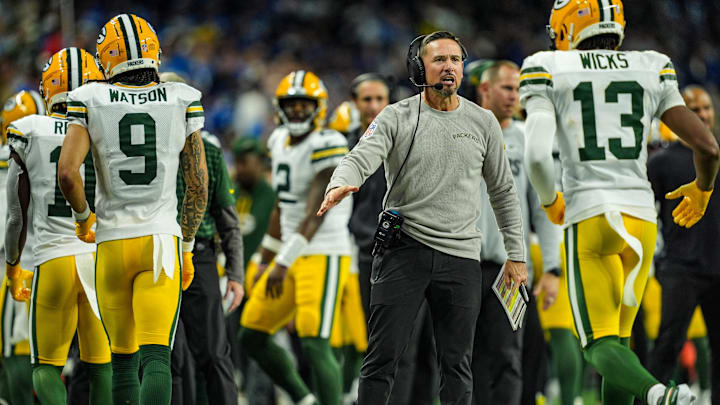 Green Bay Packers head coach Matt LaFleur slaps hands with players after the offense scores a touchdown against the Detroit Lions, during the Thursday Night Football at Ford Field in Detroit on Thursday, Dec. 5, 2024.