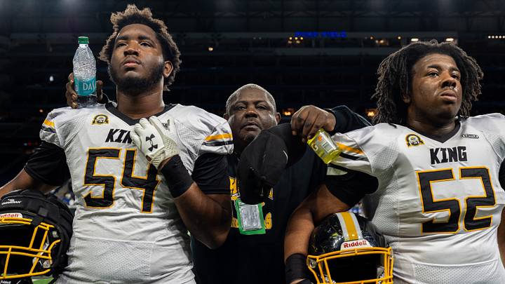 Detroit King head coach Terel Patrick, middle, stands with offensive linemen Jameer Henry (54) and Jordan Stewart (52) before the start of the 2025 Prep Bowl against Detroit Catholic Central at Ford Field in Detroit on Saturday, Oct. 25, 2025. Detroit King head coach Terel Patrick, middle, stands with offensive linemen Jameer Henry (54) and Jordan Stewart (52) before the start of the 2025 Prep Bowl against Detroit Catholic Central at Ford Field in Detroit on Saturday, Oct. 25, 2025.