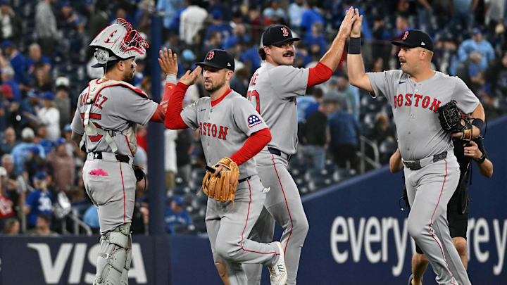 Sep 24, 2025; Toronto, Ontario, CAN; Boston Red Sox catcher Carlos Narvaez (75) celebrates with a win over the Toronto Blue Jays with third baseman Alex Bregman (2) as relief pitcher Payton Tolle (70) slaps hands with first baseman Nathaniel Lowe (37) at Rogers Centre. Mandatory Credit: Dan Hamilton-Imagn Images Sep 24, 2025; Toronto, Ontario, CAN; Boston Red Sox catcher Carlos Narvaez (75) celebrates with a win over the Toronto Blue Jays with third baseman Alex Bregman (2) as relief pitcher Payton Tolle (70) slaps hands with first baseman Nathaniel Lowe (37) at Rogers Centre. Mandatory Credit: Dan Hamilton-Imagn Images
