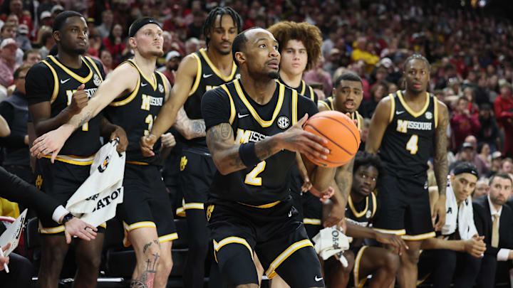 Missouri Tigers guard Tamar Bates (2) takes a shot in front of his team's bench, in a game against the Alabama Crimson Tide this season.