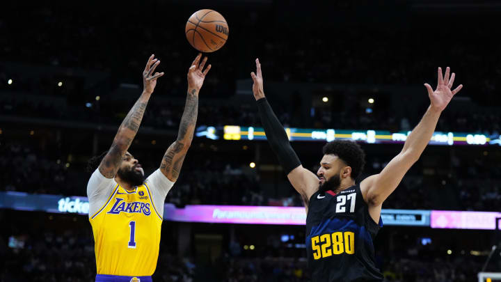Apr 22, 2024; Denver, Colorado, USA; Los Angeles Lakers guard D'Angelo Russell (1) shoots over Denver Nuggets guard Jamal Murray (27).