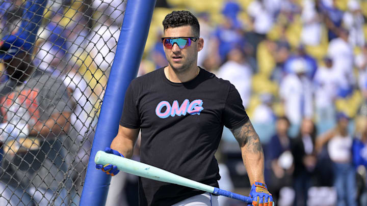 Oct 14, 2024; Los Angeles, California, USA; New York Mets second baseman Jose Iglesias (11) warms up before game two against the Los Angeles Dodgers in the NLCS for the 2024 MLB Playoffs at Dodger Stadium. Mandatory Credit: Jayne Kamin-Oncea-Imagn Images