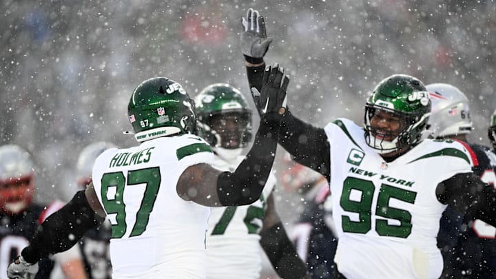 Jan 7, 2024; Foxborough, Massachusetts, USA; New York Jets defensive end Jalyn Holmes (97) celebrates with defensive tackle Quinnen Williams (95) after a sack against the New England Patriots during the second half at Gillette Stadium. 