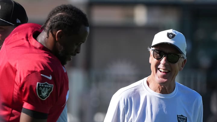 Jul 24, 2025; Henderson, NV, USA; Las Vegas Raiders quarterback Geno Smith (7) with coach Pete Carroll during training camp at the Intermountain Healthcare Performance Center. Mandatory Credit: Kirby Lee-Imagn Images