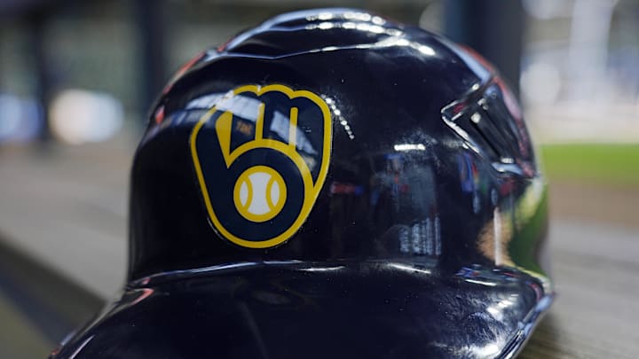 Jun 10, 2024; Milwaukee, Wisconsin, USA; A Milwaukee Brewers batting helmet sits on the bench during batting practice prior to the game against the Toronto Blue Jays at American Family Field. Mandatory Credit: Jeff Hanisch-Imagn Images Jun 10, 2024; Milwaukee, Wisconsin, USA; A Milwaukee Brewers batting helmet sits on the bench during batting practice prior to the game against the Toronto Blue Jays at American Family Field. Mandatory Credit: Jeff Hanisch-Imagn Images