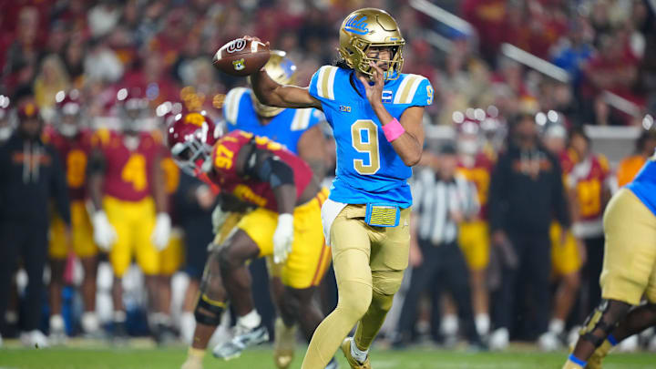 Nov 29, 2025; Los Angeles, California, USA; UCLA Bruins quarterback Nico Iamaleava (9) throws the ball against the Southern California Trojans in the first half at United Airlines Field at Los Angeles Memorial Coliseum. Mandatory Credit: Kirby Lee-Imagn Images