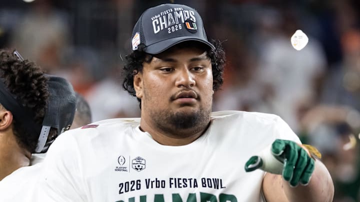 Jan 8, 2026; Glendale, AZ, USA; Miami Hurricanes offensive lineman Francis Mauigoa (61) celebrates after defeating the Mississippi Rebels during the 2026 Fiesta Bowl and semifinal game of the College Football Playoff at State Farm Stadium. Mandatory Credit: Mark J. Rebilas-Imagn Images