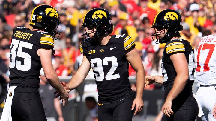 Iowa Hawkeyes kicker Caden Buhr (92) high fives Iowa Hawkeyes punter Tanner Philpott (35) after making a field goal against the Ohio State Buckeyes Oct. 3, 2026 at Kinnick Stadium in Iowa City, Iowa.