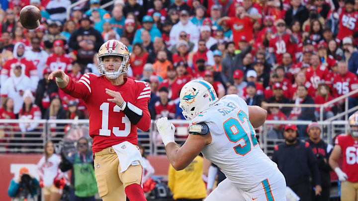 San Francisco 49ers quarterback Brock Purdy (13) throws the ball under pressure from Miami Dolphins defensive end Zach Sieler (92) during the first quarter at Levi's Stadium in the teams' 2022 matchup. San Francisco 49ers quarterback Brock Purdy (13) throws the ball under pressure from Miami Dolphins defensive end Zach Sieler (92) during the first quarter at Levi's Stadium in the teams' 2022 matchup.