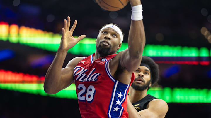 Jan 24, 2025; Philadelphia, Pennsylvania, USA; Philadelphia 76ers forward Guerschon Yabusele (28) rebounds the ball past Cleveland Cavaliers center Jarrett Allen (31) during the third quarter at Wells Fargo Center. Mandatory Credit: Bill Streicher-Imagn Images