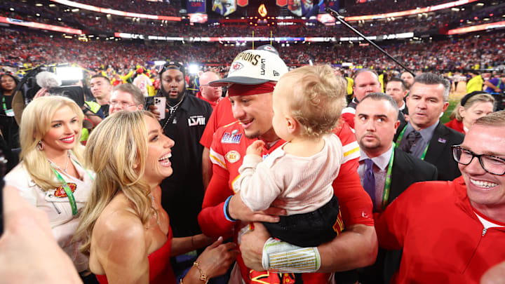 Feb 11, 2024; Paradise, Nevada, USA; Kansas City Chiefs quarterback Patrick Mahomes (15) celebrates with wife Brittney Mahomes after defeating the San Francisco 49ers in Super Bowl LVIII at Allegiant Stadium. Mandatory Credit: Mark J. Rebilas-Imagn Images