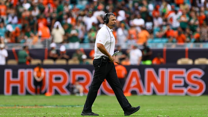 Nov 2, 2024; Miami Gardens, Florida, USA; Miami Hurricanes head coach Mario Cristobal looks on from the field against the Duke Blue Devils during the fourth quarter at Hard Rock Stadium. Mandatory Credit: Sam Navarro-Imagn Images