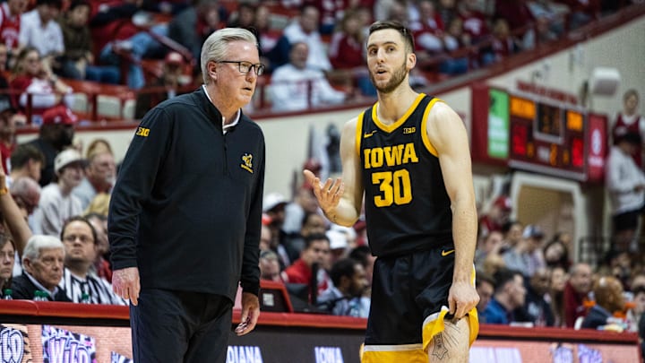Feb 28, 2023; Bloomington, Indiana, USA; Iowa Hawkeyes head coach Fran McCaffery and guard Connor McCaffery (30) in the second half against the Indiana Hoosiers at Simon Skjodt Assembly Hall. Mandatory Credit: Trevor Ruszkowski-Imagn Images