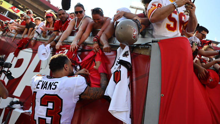 Sep 29, 2024; Tampa, Florida, USA; Tampa Bay Buccaneers wide receiver Mike Evans (13) signs autographs after the game against the Philadelphia Eagles at Raymond James Stadium. Mandatory Credit: Kim Klement Neitzel-Imagn Images
