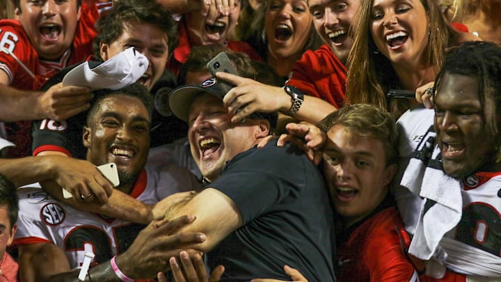 Georgia running back Brian Herrien (35) and Coach Kirby Smart celebrates with fans at the end of a NCAA football game between Georgia and Tennessee in Knoxville, Tenn., on Saturday, Oct. 5, 2019, Final score Georgia 43 - Tennessee 14. [Photo/Joseph Sisson Contributor, Athens Banner-Herald]