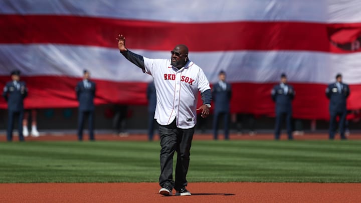 Apr 15, 2022; Boston, Massachusetts, USA; Former Boston Red Sox player Mo Vaughn (42) waves to the crowd at Fenway Park. Every player is wearing number 42 in honor of Jackie Robinson. Mandatory Credit: Paul Rutherford-Imagn Images