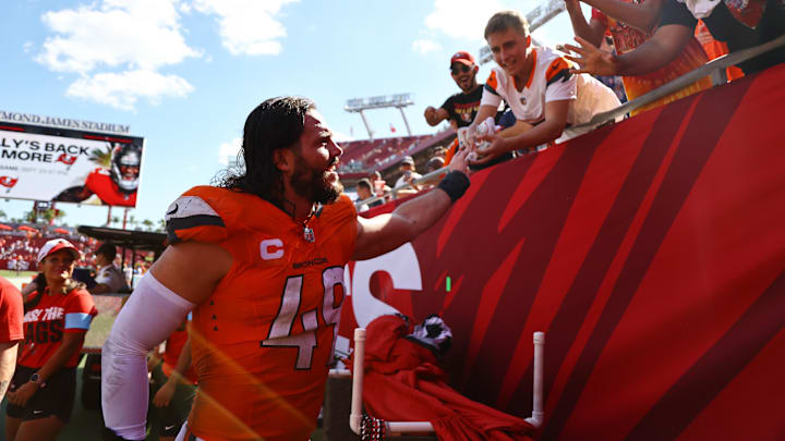 Sep 22, 2024; Tampa, Florida, USA; Denver Broncos linebacker Alex Singleton (49) greets fans after the game against the Tampa Bay Buccaneers at Raymond James Stadium. 