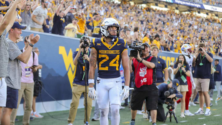 Sep 21, 2024; Morgantown, West Virginia, USA; West Virginia Mountaineers wide receiver Rodney Gallagher III (24) catches a pass for a touchdown late during the fourth quarter against the Kansas Jayhawks at Mountaineer Field at Milan Puskar Stadium. Mandatory Credit: Ben Queen-Imagn Images