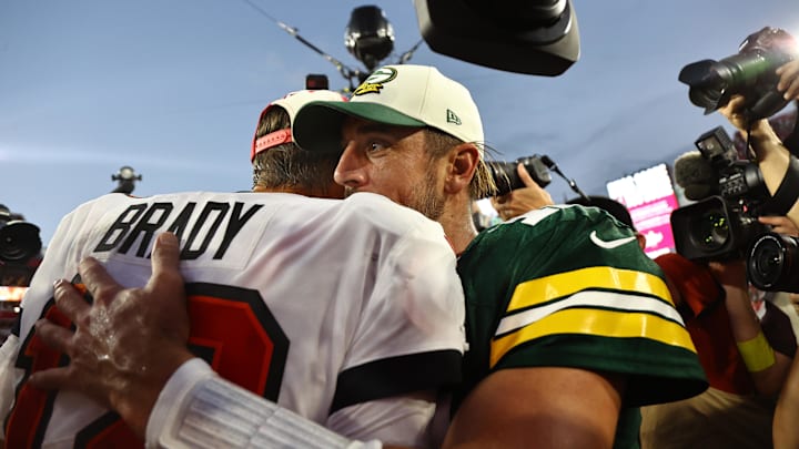 Sep 25, 2022; Tampa, Florida, USA; Tampa Bay Buccaneers quarterback Tom Brady (12) and Green Bay Packers quarterback Aaron Rodgers (12) greet after the game at Raymond James Stadium. Mandatory Credit: Kim Klement-Imagn Images