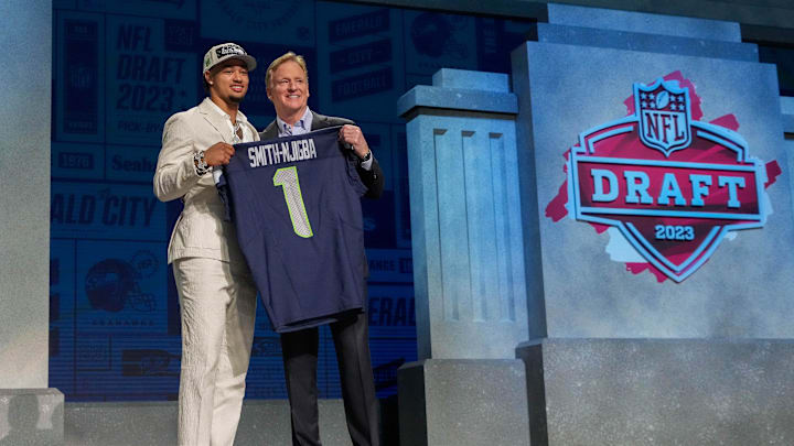 Apr 27, 2023; Kansas City, MO, USA; Ohio State wide receiver Jaxon Smith-Njigba with NFL commissioner Roger Goodell after being selected by the Seattle Seahawks twentieth overall in the first round of the 2023 NFL Draft at Union Station. Mandatory Credit: Kirby Lee-Imagn Images Apr 27, 2023; Kansas City, MO, USA; Ohio State wide receiver Jaxon Smith-Njigba with NFL commissioner Roger Goodell after being selected by the Seattle Seahawks twentieth overall in the first round of the 2023 NFL Draft at Union Station. Mandatory Credit: Kirby Lee-Imagn Images