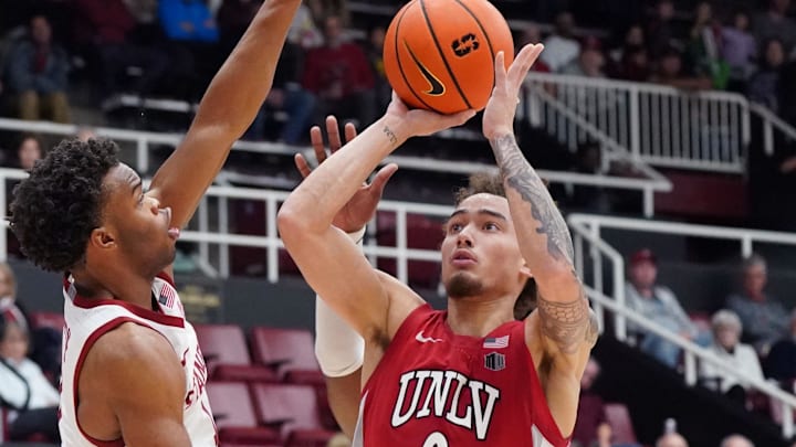 UNLV Runnin' Rebels guard Dra Gibbs-Lawhorn (0) shoots against Stanford Cardinal guard Ebuka Okorie (1) in the second half at Maples Pavilion. Mandatory Credit: David Gonzales-Imagn Images