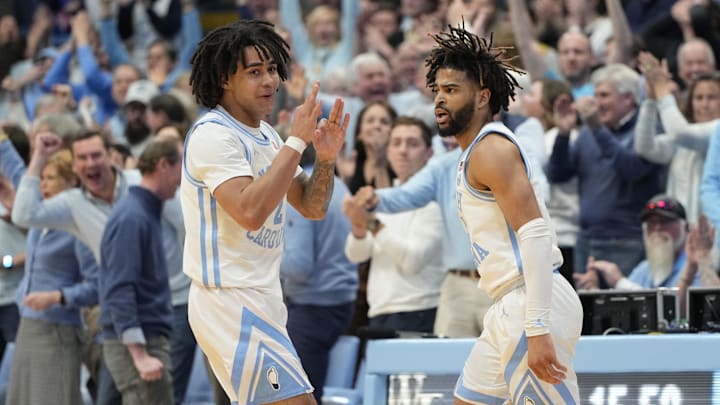 Jan 22, 2024; Chapel Hill, North Carolina, USA; North Carolina Tar Heels guard RJ Davis (4) reacts with guard Elliot Cadeau (2) after hitting a three point shot in the second half at Dean E. Smith Center. Mandatory Credit: Bob Donnan-USA TODAY Sports