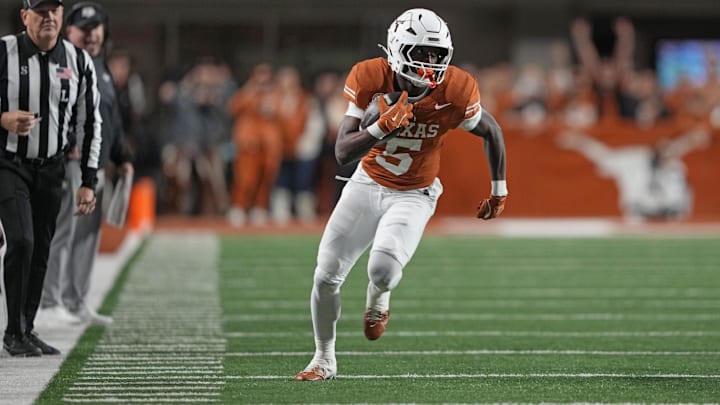Nov 28, 2025; Austin, Texas, USA; Texas Longhorns running back Quintrevion Wisner (5) runs down the sideline during the first half against the Texas A&M Aggies.