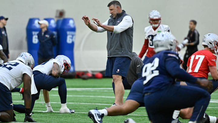 May 9, 2025; Foxborough, MA, USA; New England Patriots head coach Mike Vrabel (c) works with players at rookie camp at Gillette Stadium. Mandatory Credit: Eric Canha-Imagn Images
