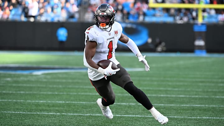 Dec 21, 2025; Charlotte, North Carolina, USA; Tampa Bay Buccaneers running back Rachaad White (1) with the ball in the third quarter at Bank of America Stadium. Mandatory Credit: Bob Donnan-Imagn Images