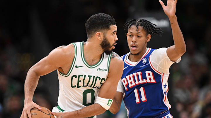 Oct 12, 2024; Boston, Massachusetts, USA; Boston Celtics forward Jayson Tatum (0) drives to the basket against Philadelphia 76ers guard Jeff Dowtin Jr. (11) during the first half at the TD Garden. Mandatory Credit: Brian Fluharty-Imagn Images