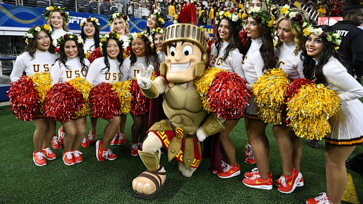 Jan 2, 2023; Arlington, Texas, USA; A view of the USC Trojans song girl cheerleaders and mascot during the first half of the game between the USC Trojans and the Tulane Green Wave in the 2023 Cotton Bowl at AT&T Stadium. Mandatory Credit: Jerome Miron-USA TODAY Sports