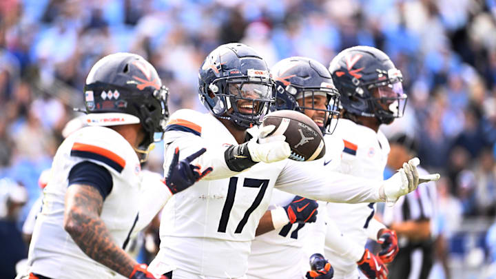 Oct 25, 2025; Chapel Hill, North Carolina, USA; Virginia Cavaliers defensive end Mitchell Melton (17) celebrates with linebacker Maddox Marcellus (11) after intercepting the ball in the third quarter at Kenan Stadium. Mandatory Credit: Bob Donnan-Imagn Images Oct 25, 2025; Chapel Hill, North Carolina, USA; Virginia Cavaliers defensive end Mitchell Melton (17) celebrates with linebacker Maddox Marcellus (11) after intercepting the ball in the third quarter at Kenan Stadium. Mandatory Credit: Bob Donnan-Imagn Images