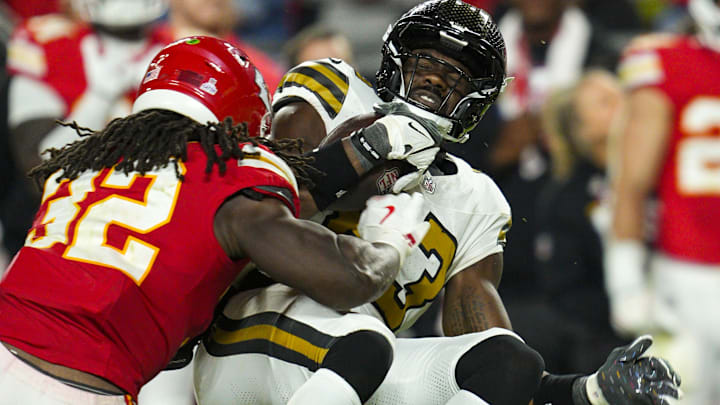 Oct 7, 2024; Kansas City, Missouri, USA; New Orleans Saints tight end Juwan Johnson (83) is tackled by Kansas City Chiefs linebacker Nick Bolton (32) during the second half at GEHA Field at Arrowhead Stadium. Mandatory Credit: Jay Biggerstaff-Imagn Images Oct 7, 2024; Kansas City, Missouri, USA; New Orleans Saints tight end Juwan Johnson (83) is tackled by Kansas City Chiefs linebacker Nick Bolton (32) during the second half at GEHA Field at Arrowhead Stadium. Mandatory Credit: Jay Biggerstaff-Imagn Images
