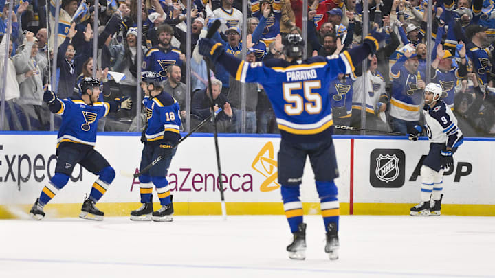 Apr 24, 2025; St. Louis, Missouri, USA; St. Louis Blues defenseman Cam Fowler (17) is congratulated by teammates after scoring against the Winnipeg Jets during the first period in game three of the first round of the 2025 Stanley Cup Playoffs at Enterprise Center. Mandatory Credit: Jeff Curry-Imagn Images