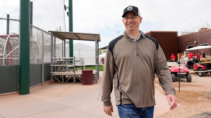Reds president of baseball operations Nick Krall walks between fields at the Cincinnati Reds Player Development Complex in Goodyear, Ariz., on Wednesday, Feb. 12, 2025.