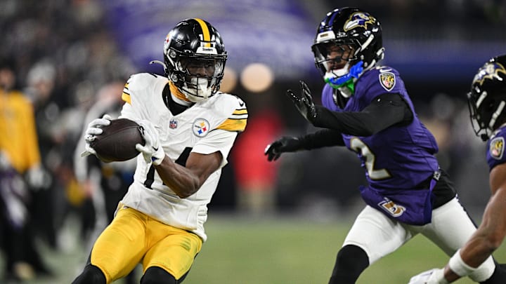 Jan 11, 2025; Baltimore, Maryland, USA; Pittsburgh Steelers wide receiver George Pickens (14) makes a catch against Baltimore Ravens cornerback Nate Wiggins (2) in the third quarter in an AFC wild card game at M&T Bank Stadium. Mandatory Credit: Tommy Gilligan-Imagn Images