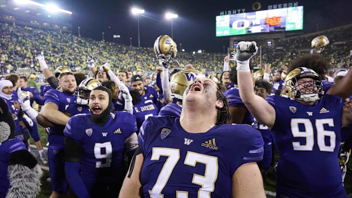  Huskies offensive tackle Roger Rosengarten (73) celebrates a 37-34 win at Autzen Stadium in 2022.