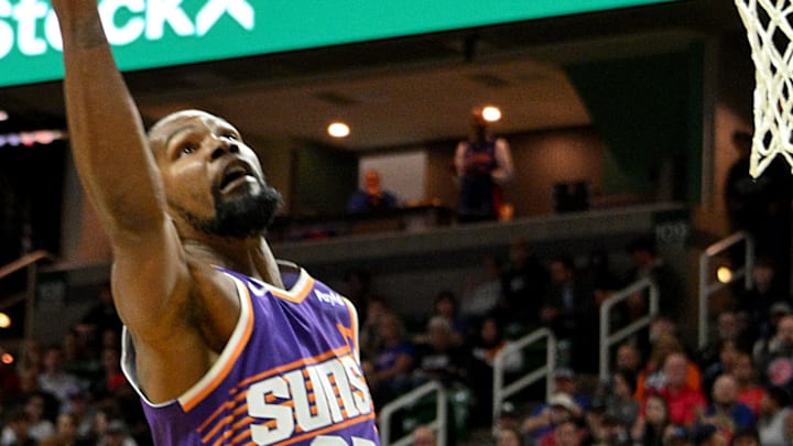 Oct 8, 2024; East Lansing, Michigan, USA;  Phoenix Suns forward Kevin Durant (35) grabs a first quarter rebound against the Detroit Pistons at Jack Breslin Student Events Center. Mandatory Credit: Dale Young-Imagn Images