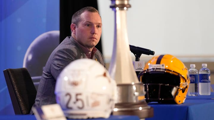 Arizona State head coach Kenny Dillingham listens to a question during a joint news conference with Texas head coach Steve Sarkisian before facing off in the Chick-fil-A Peach Bowl. Arizona State head coach Kenny Dillingham listens to a question during a joint news conference with Texas head coach Steve Sarkisian before facing off in the Chick-fil-A Peach Bowl.