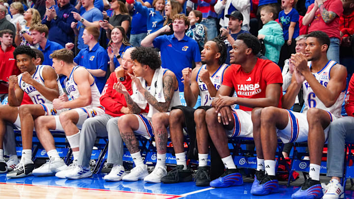 Jan 6, 2026; Lawrence, Kansas, USA; Kansas Jayhawks players and fans celebrate against the TCU Horned Frogs during overtime of the game at Allen Fieldhouse. Mandatory Credit: Denny Medley-Imagn Images