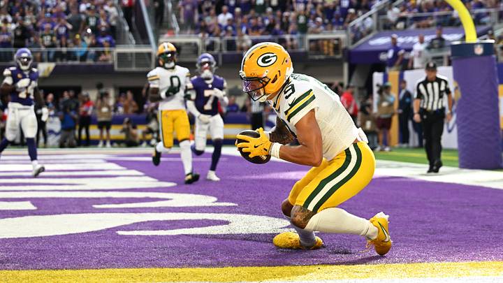 Sep 13, 2026; Minneapolis, Minnesota, USA;  Green Bay Packers wide receiver Christian Watson (9) makes a touchdown during the second half against the Minnesota Vikings at U.S. Bank Stadium.  Mandatory Credit: Jeffrey Becker-Imagn Images