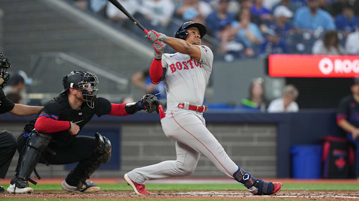 Jun 19, 2024; Toronto, Ontario, CAN; Boston Red Sox second baseman Enmanuel Valdez (47) hits a home run against the Toronto Blue Jays during fourth inning at Rogers Centre.