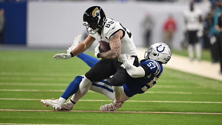 Jan 5, 2025; Indianapolis, Indiana, USA; Jacksonville Jaguars tight end Luke Farrell (89) is tackled by Indianapolis Colts linebacker Jaylon Carlies (57) during the first quarter at Lucas Oil Stadium. Mandatory Credit: Marc Lebryk-Imagn Images Jan 5, 2025; Indianapolis, Indiana, USA; Jacksonville Jaguars tight end Luke Farrell (89) is tackled by Indianapolis Colts linebacker Jaylon Carlies (57) during the first quarter at Lucas Oil Stadium. Mandatory Credit: Marc Lebryk-Imagn Images