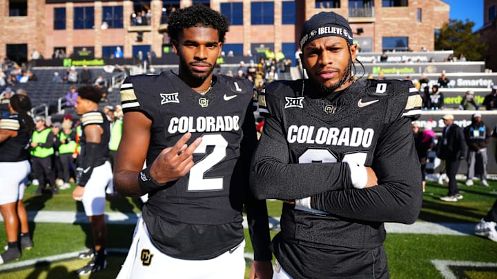 Colorado Buffaloes quarterback Shedeur Sanders (2) and safety Shilo Sanders (21) before the game against the Oklahoma State Cowboys at Folsom Field.