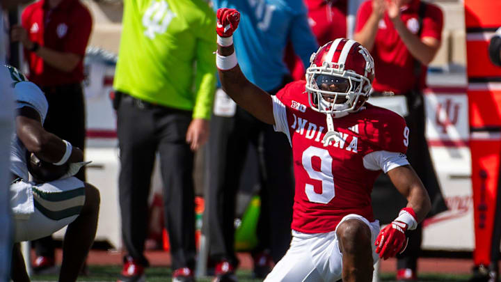 Indiana's Jamier Johnson (9) celebrates a third down stop against Charlotte at Memorial Stadium.