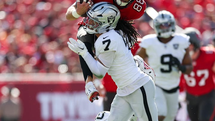 Dec 8, 2024; Tampa, Florida, USA; Tampa Bay Buccaneers tight end Cade Otton (88) is stopped by Las Vegas Raiders safety Tre'von Moehrig (7) in the first quarter at Raymond James Stadium. Mandatory Credit: Nathan Ray Seebeck-Imagn Images Dec 8, 2024; Tampa, Florida, USA; Tampa Bay Buccaneers tight end Cade Otton (88) is stopped by Las Vegas Raiders safety Tre'von Moehrig (7) in the first quarter at Raymond James Stadium. Mandatory Credit: Nathan Ray Seebeck-Imagn Images