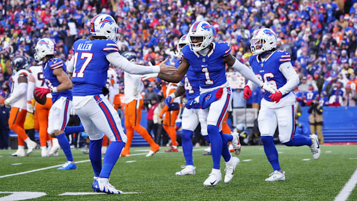 Jan 12, 2025; Orchard Park, New York, USA; Buffalo Bills quarterback Josh Allen (17) celebrates a touchdown by wide receiver Curtis Samuel (1) during the fourth quarter