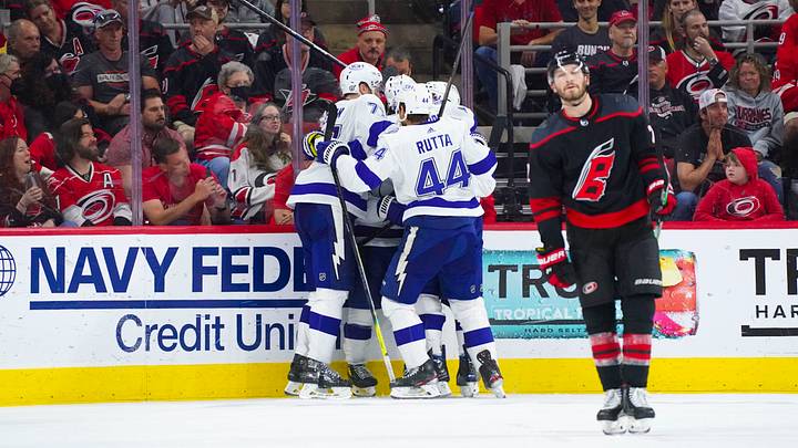 Jun 8, 2021; Raleigh, North Carolina, USA; Tampa Bay Lightning left wing Ross Colton (79) is congratulated by left wing Pat Maroon (14) defenseman Victor Hedman (77) and defenseman Jan Rutta (44) after his third period goal against the Carolina Hurricanes in game five of the second round of the 2021 Stanley Cup Playoffs at PNC Arena. Mandatory Credit: James Guillory-USA TODAY Sports