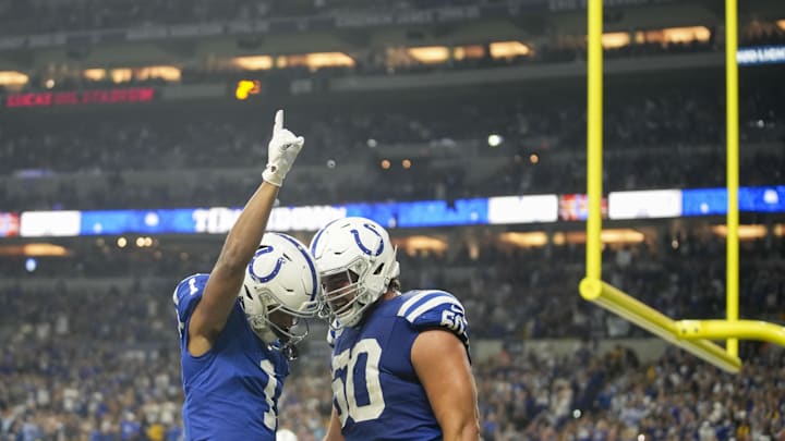 Sep 29, 2024; Indianapolis, Indiana, USA; Indianapolis Colts wide receiver Josh Downs (1) celebrates with Indianapolis Colts linebacker Segun Olubi (50) after scoring a touchdown Sunday, Sept. 29, 2024, during a game against the Pittsburgh Steelers at Lucas Oil Stadium in Indianapolis. 