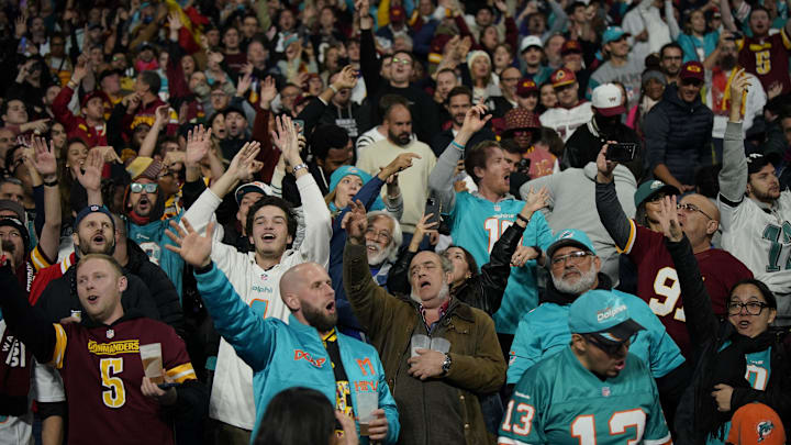 [US, Mexico & Canada customers only] Nov 16, 2025; Madrid, SPAIN; Washington Commanders and Miami Dolphins fans cheer in the 2025 NFL Madrid Game at Santiago Bernabeu Stadium. Mandatory Credit: Ana Beltran/Reuters via Imagn Images